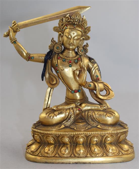 A Sino-Tibetan gilt bronze seated figure of Manjushri, 19cm